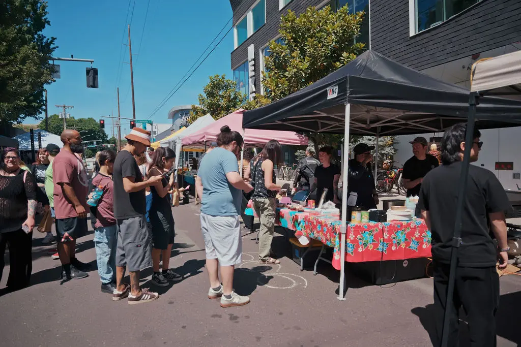 Street fair crowd and outdoor festival scene.